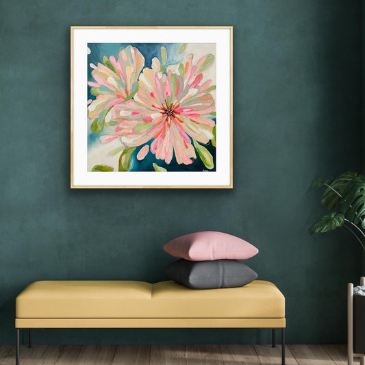 Framed Art Print on Paper "Bloom Large' on a green wall above a bench with pillows.