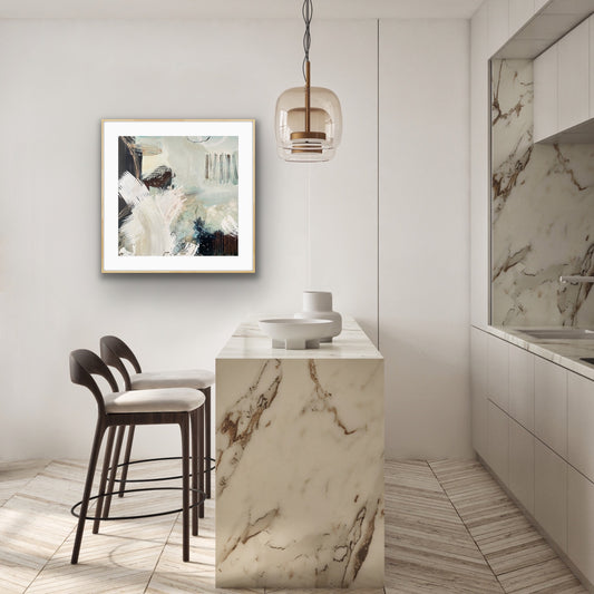 Modern kitchen with marble island, stools, and abstract art print "Siren's Swell" by Alison Gilbert Art, on the wall.