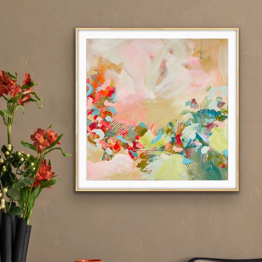 Abstract giclee print "Whispers of a New Day" on a wall above a table with a vase, mug, and book.