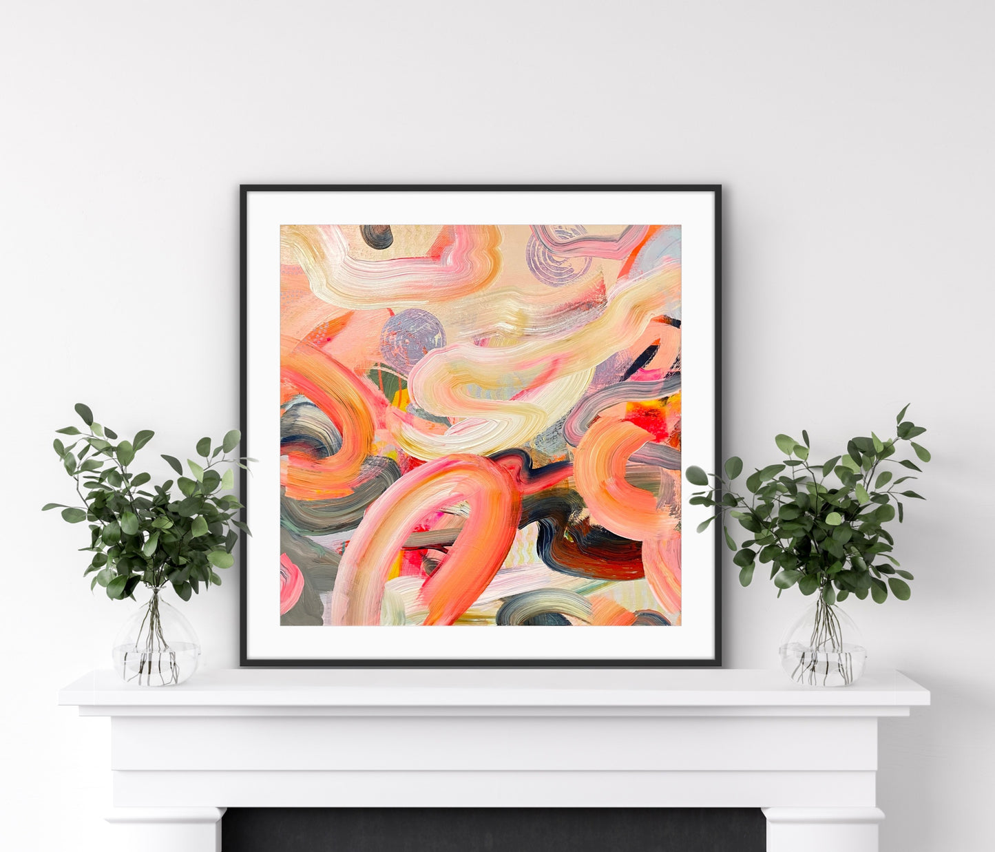 Framed abstract Art Print on Paper 'Wurlitzer' on a white wall above a fireplace with two small potted plants.