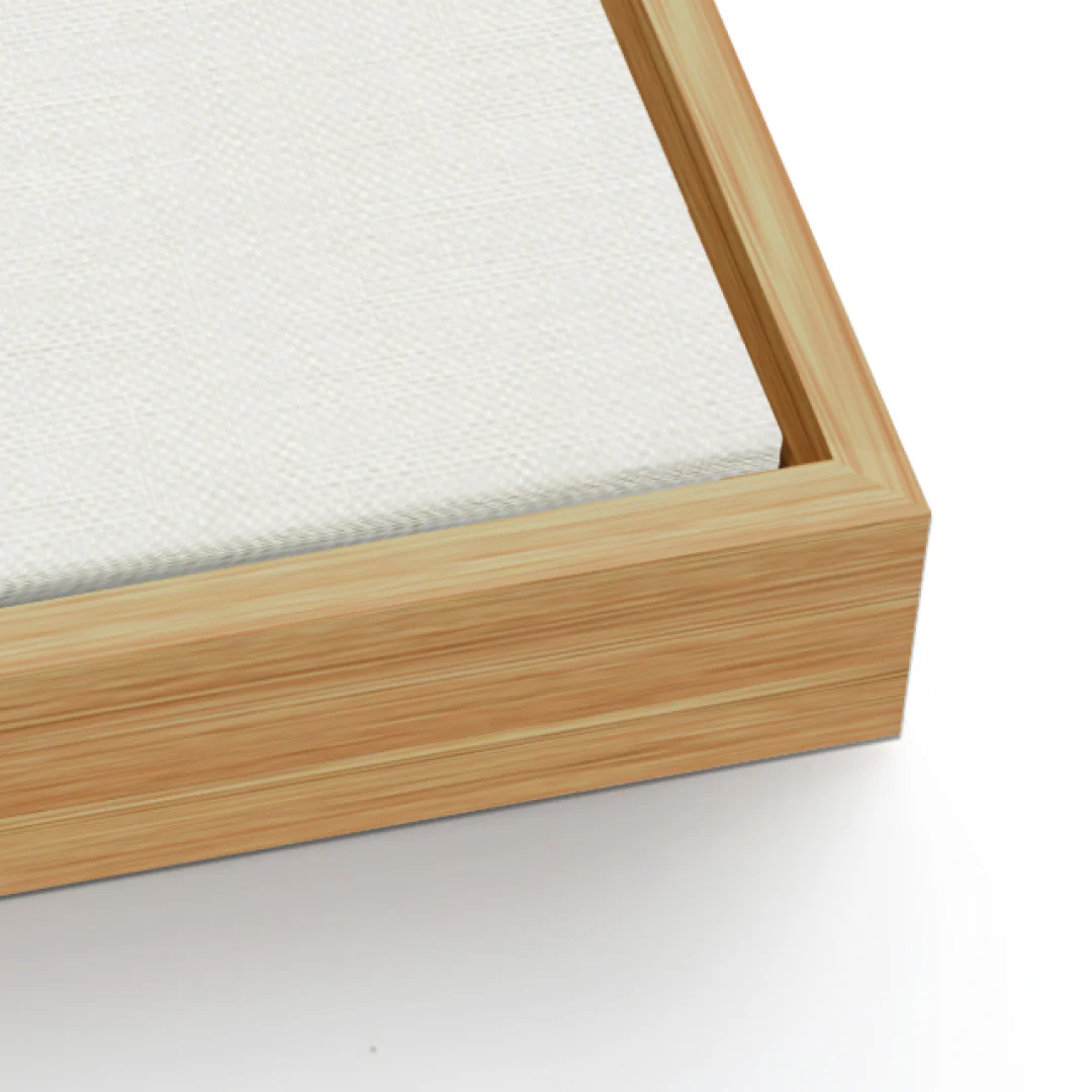 Close-up of a wooden frame with a canvas corner on a white background