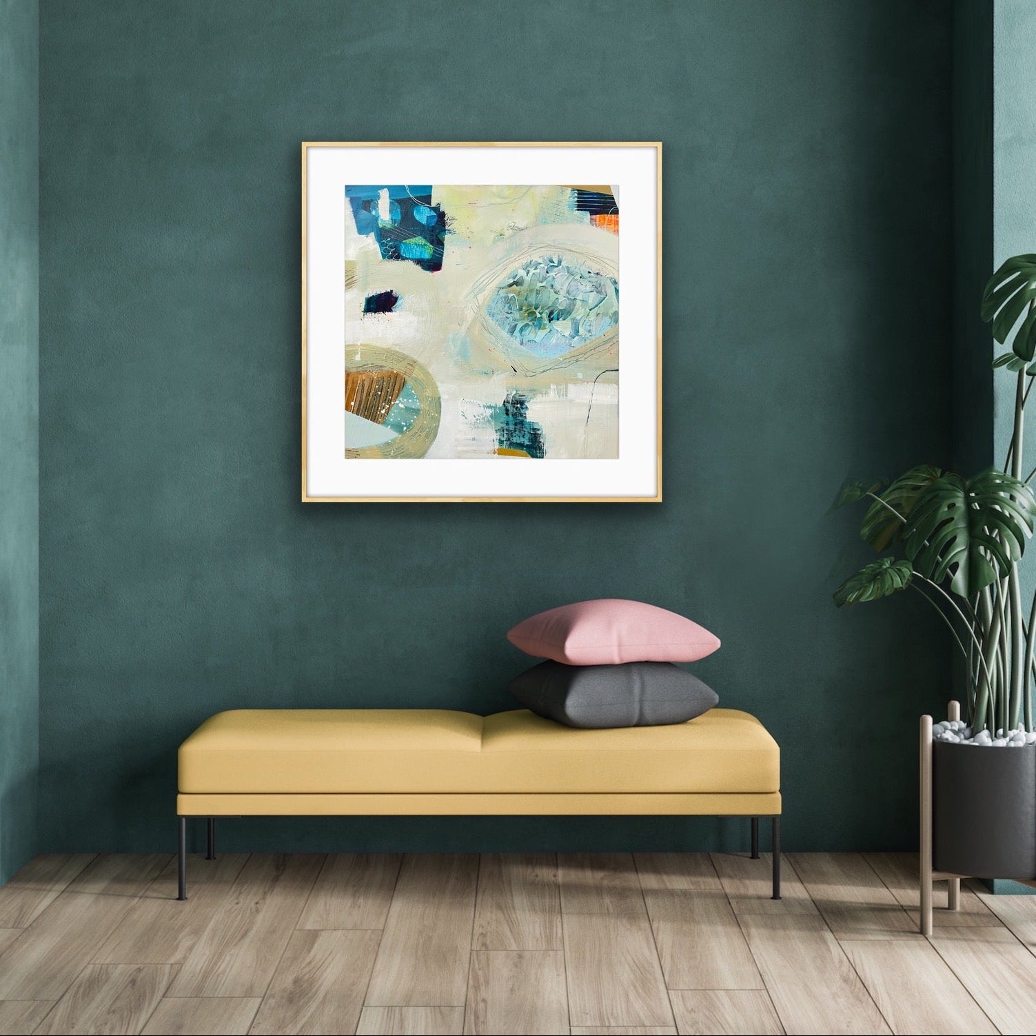 Modern interior with a yellow bench, colorful pillows, and a framed abstract art print, "Beachcombing" by Alison Gilbert Art, on a green wall.