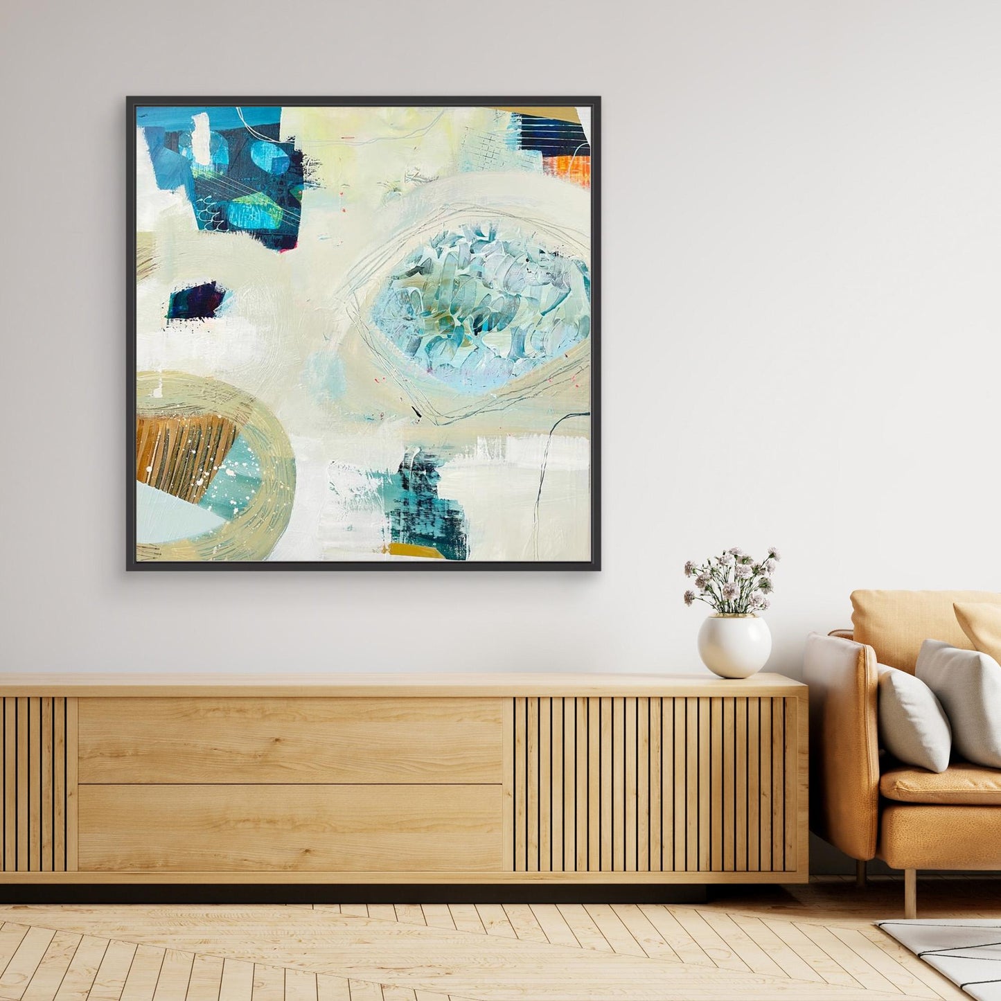 'Beachcombing'  abstract framed canvas print on a wall above a wooden console table in a living room.