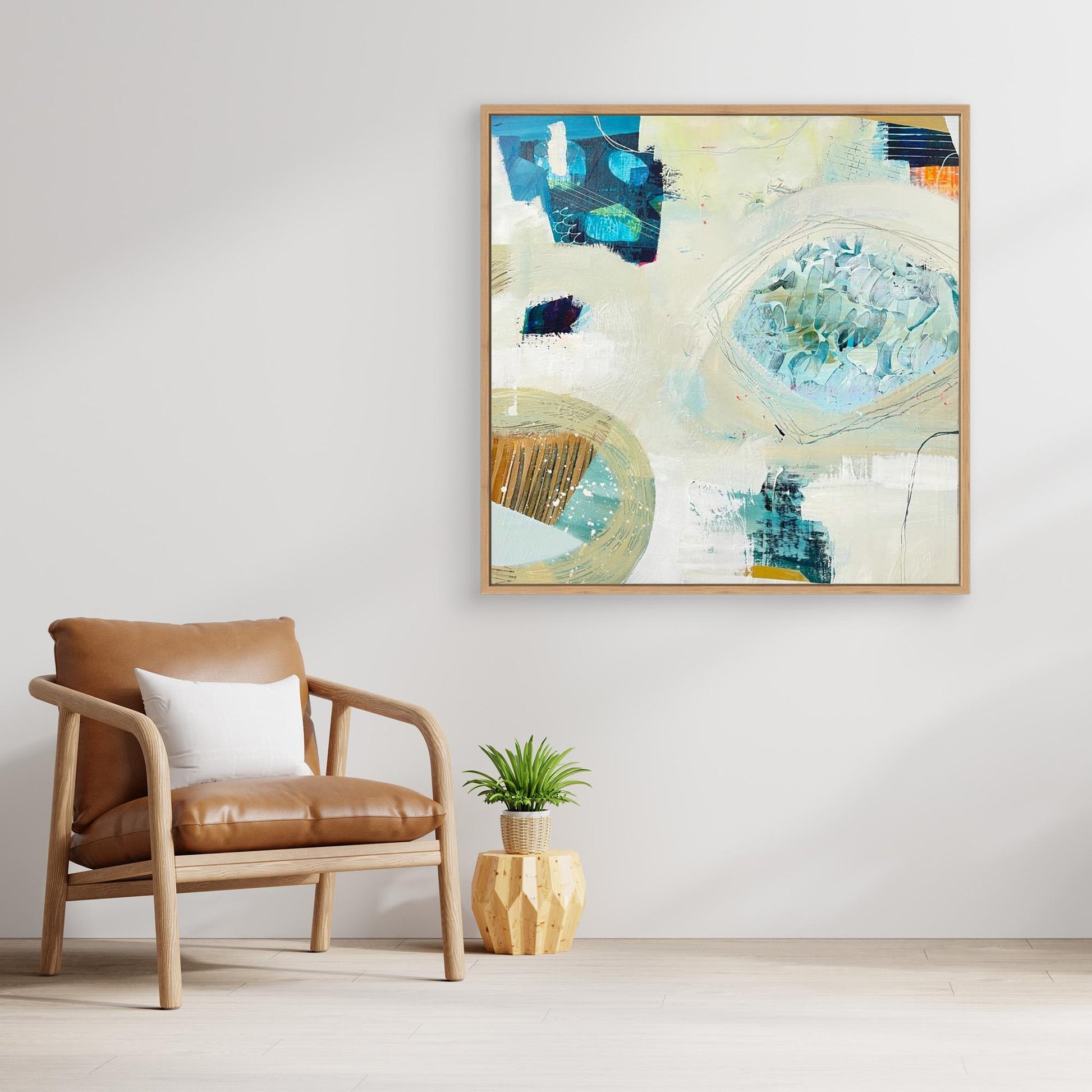 'Beachcombing'  abstract framed canvas print on a wall above an armchair in a living room.