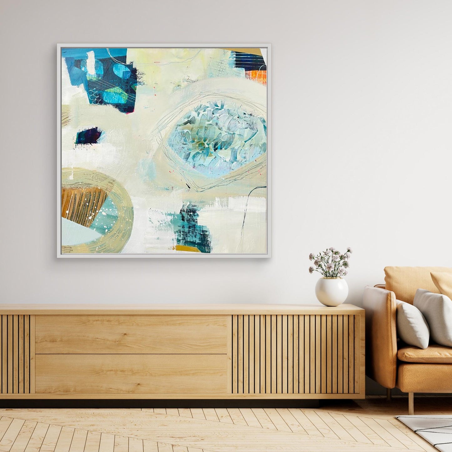 'Beachcombing'  abstract framed canvas print on a wall above a wooden console table in a living room.