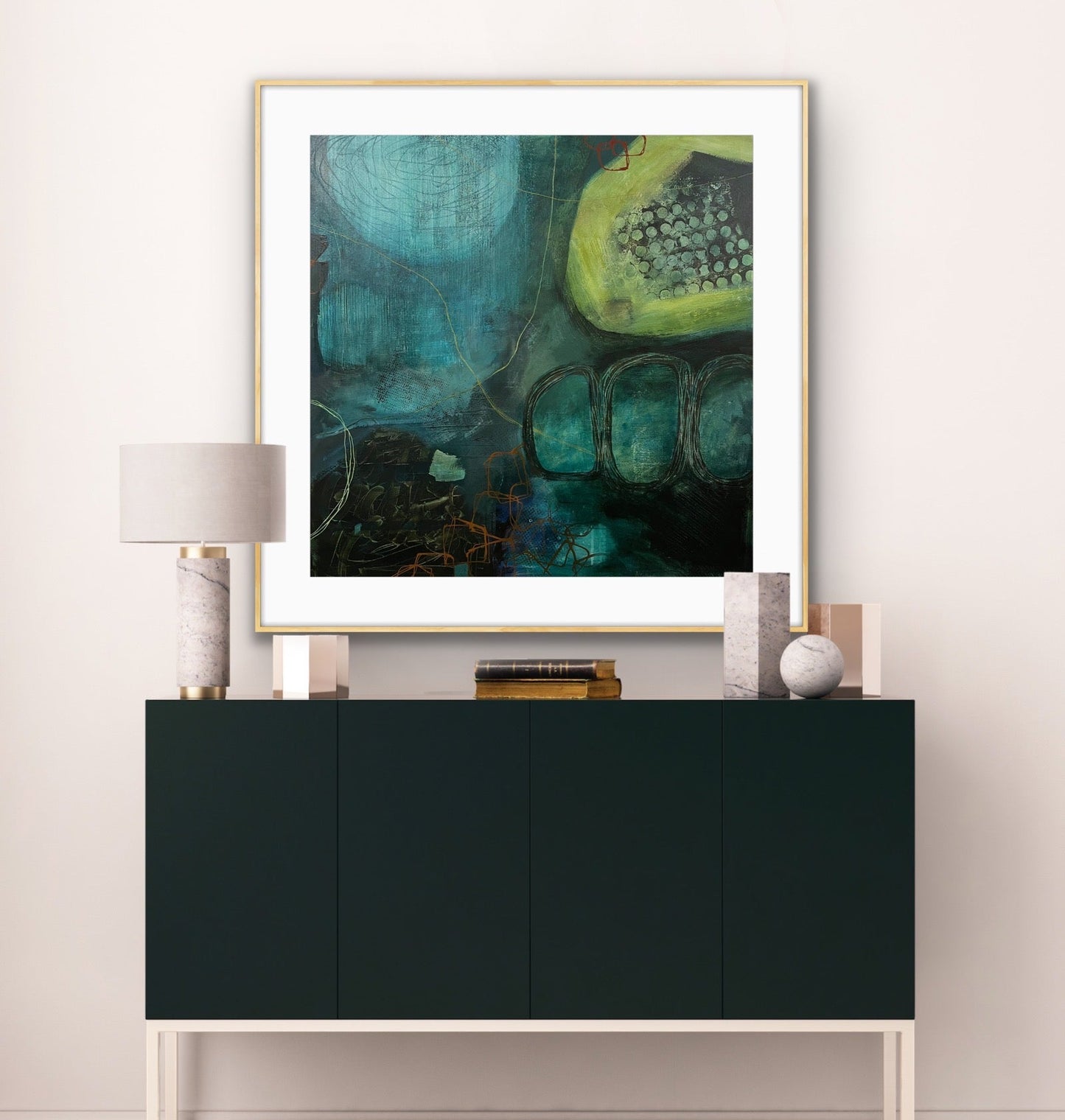 Framed, abstract art print "Behind the Waterfall" by Alison Gilbert Art, on a white wall above a black cabinet in a room.