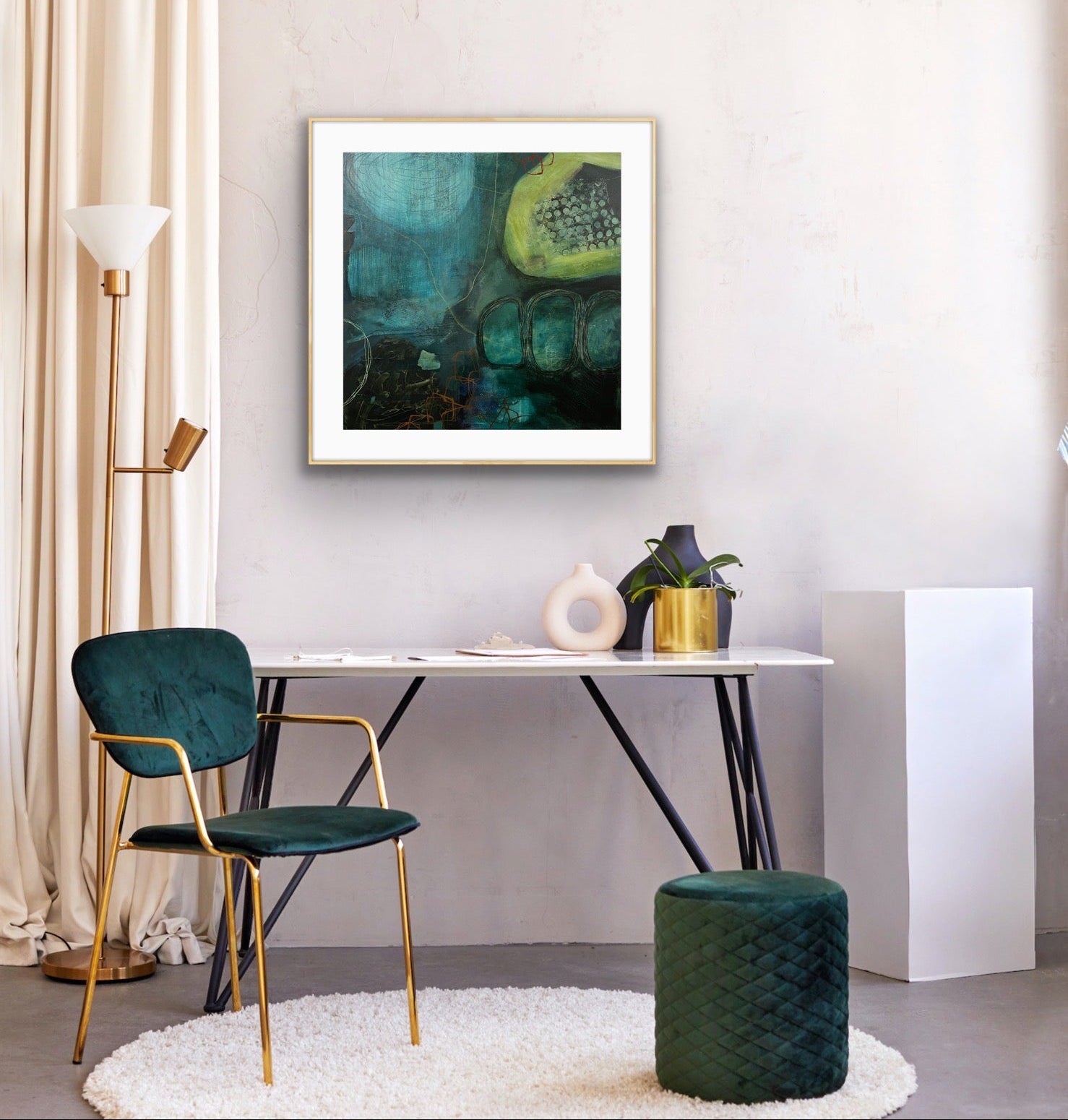 Modern interior with a desk, chair, and a framed abstract print "Behind the Waterfall" on a white wall.