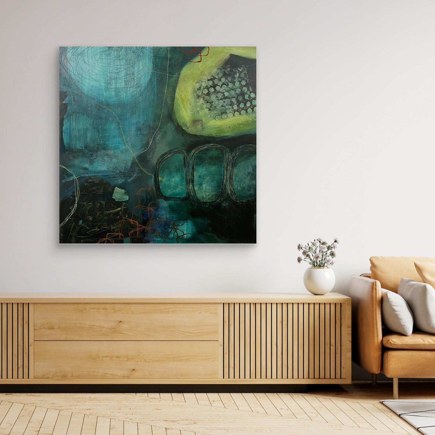 Abstract canvas print 'Behind the Waterfall' on a wall above a wooden console table in a living room.