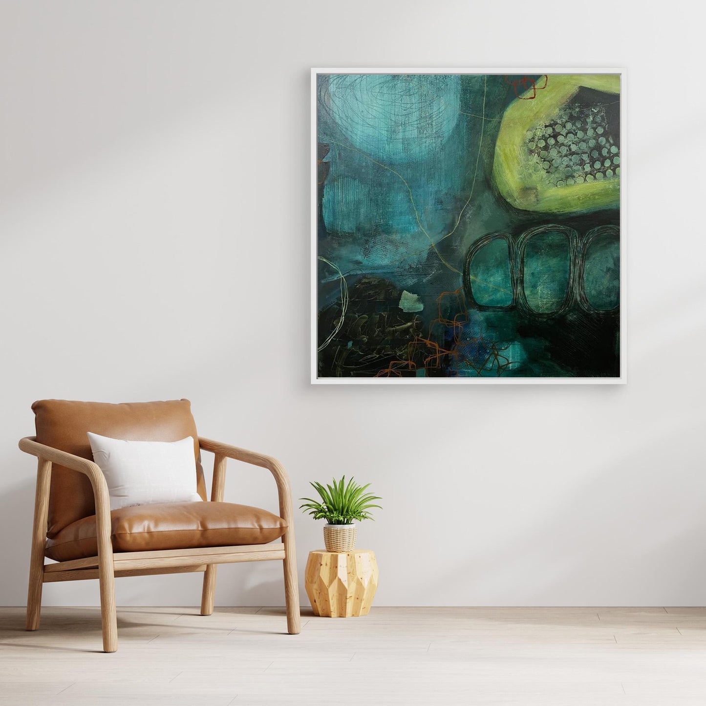 Modern interior with a brown leather chair, white pillow, and abstract canvas print 'Behind the Waterfall' on a white wall.