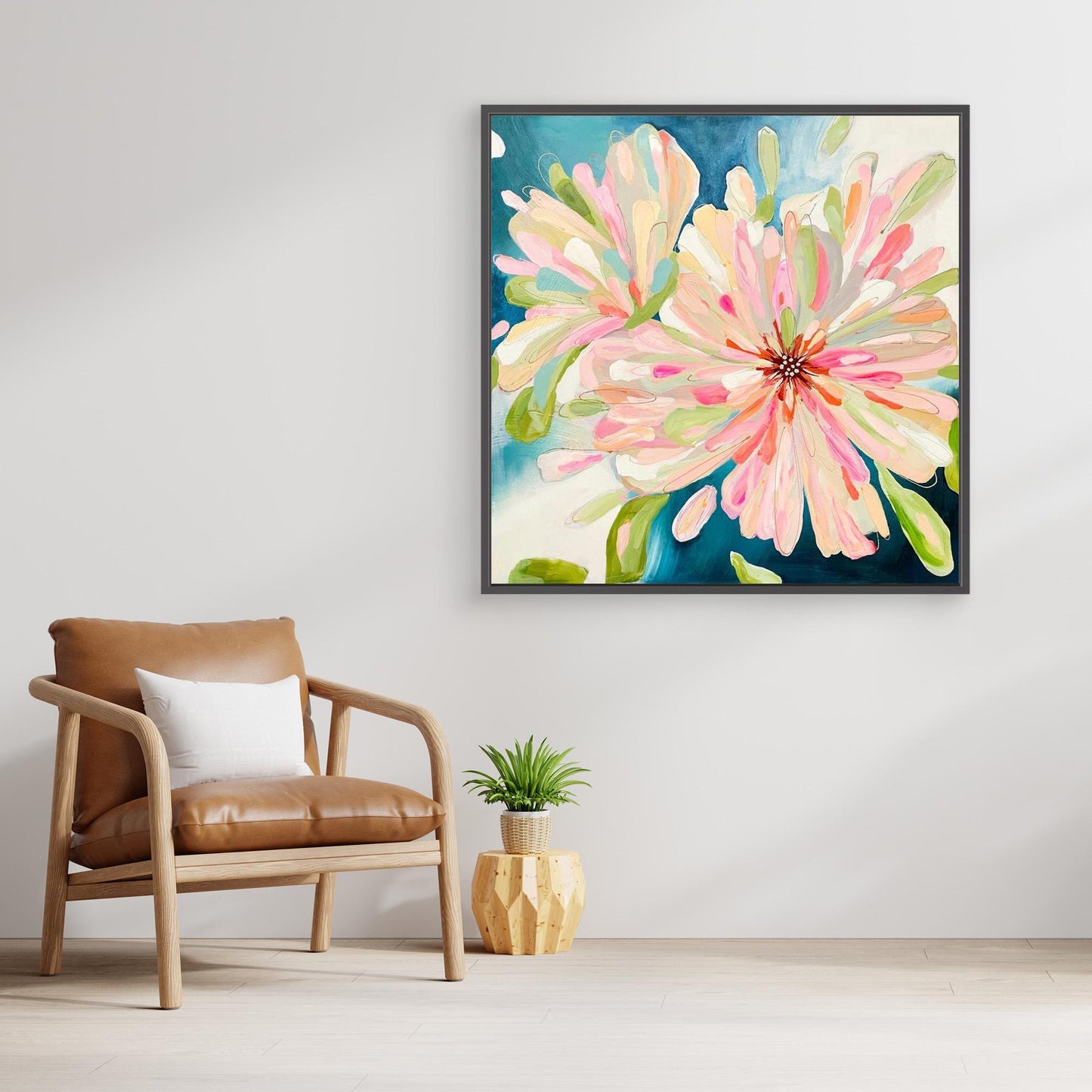 Abstract canvas print 'Bloom Large'on a wall above an armchair in a living room.