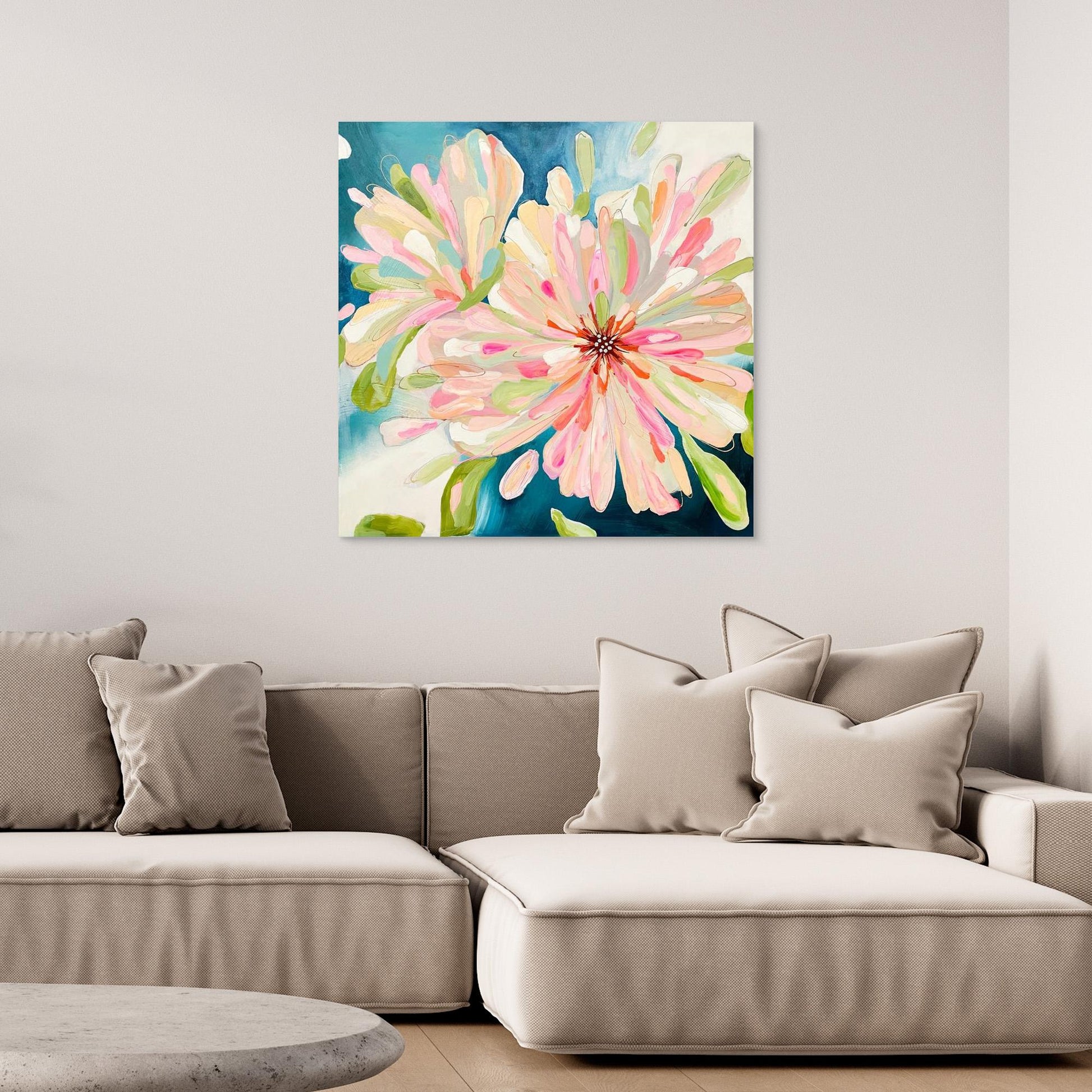 Abstract canvas print 'Bloom Large'on a wall above a sofa in a living room. 