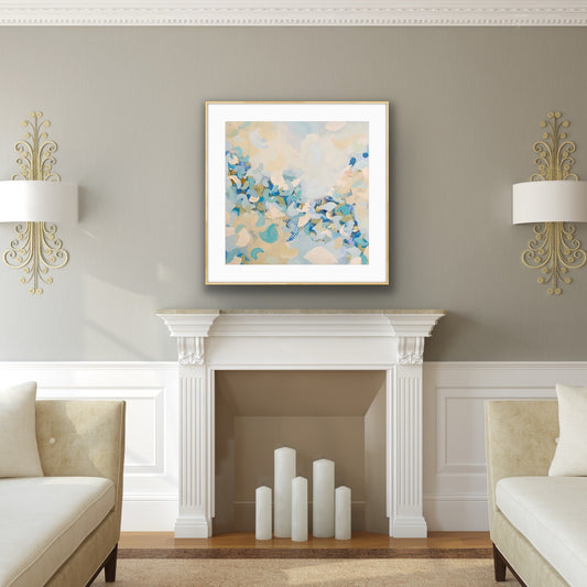 Living room with a fireplace, decorative wall art print "Blue Blossom", and two lamps.