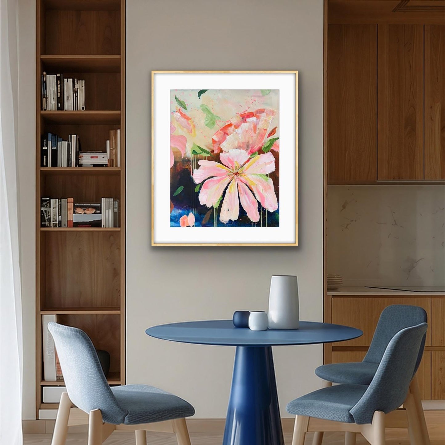Modern interior with a blue table and chairs, a bookshelf, and a floral print 'Botanical Dream' on the wall.