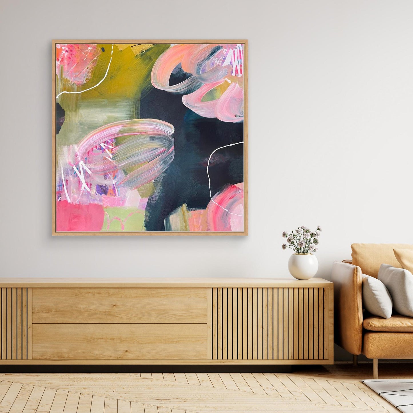 Abstract Alison Gilbert canvas print 'Bubblegum' in a modern living room setting with a wooden cabinet and sofa.