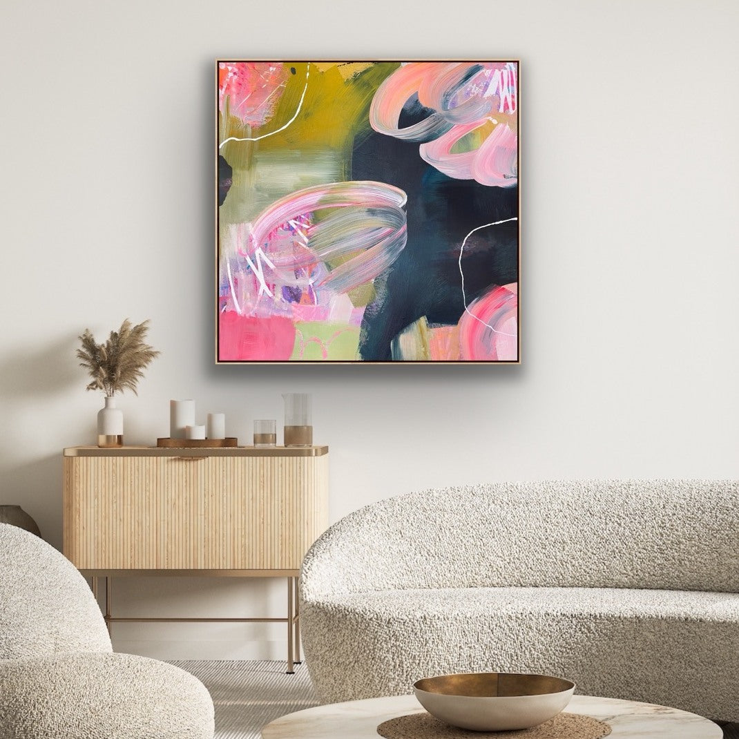 Abstract Alison Gilbert canvas print 'Bubblegum'  on a wall above a wooden cabinet in a living room.