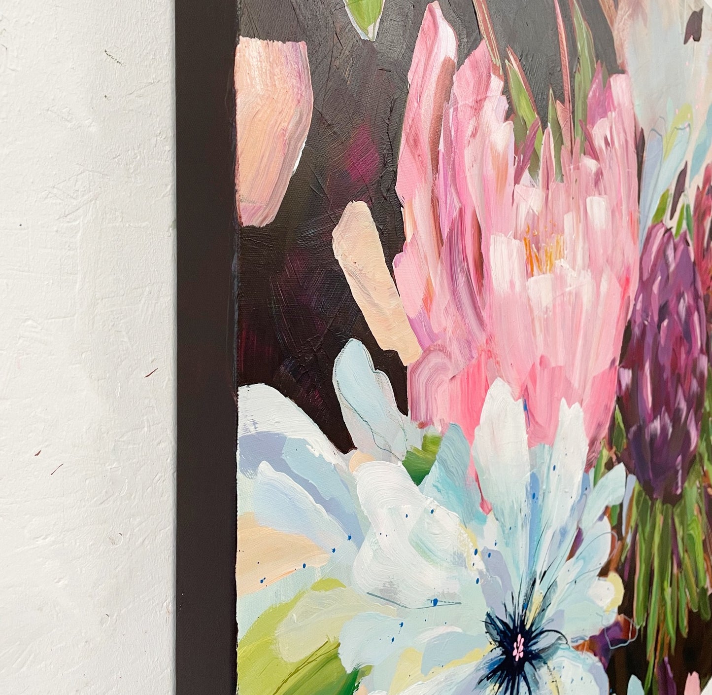 Side view of 'Blowsy Blooms'a colourful abstract floral painting