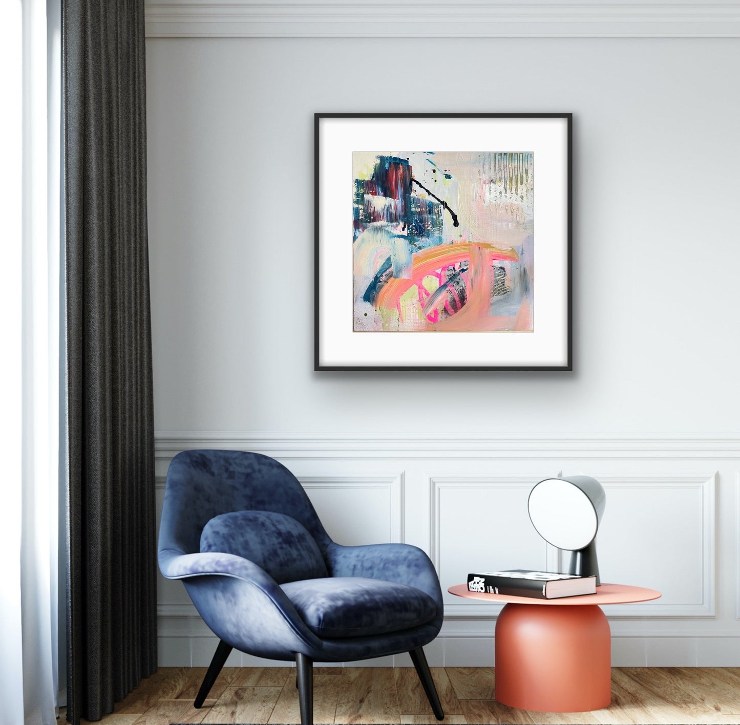Modern interior with a blue armchair, pink side table, and abstract art giclee print "Chaos" on the wall.