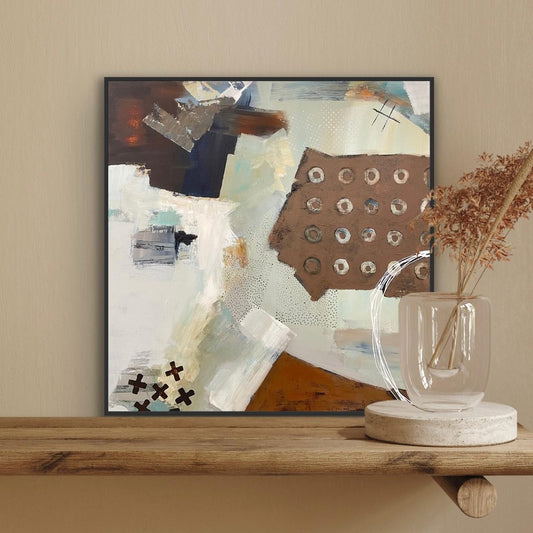 Abstract Alison Gilbert canvas print 'Echoes' on a wall above a wooden shelf with decorative items.