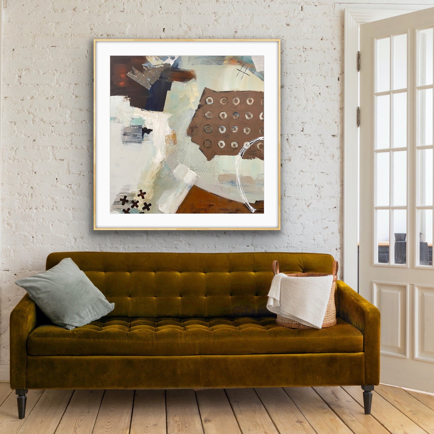 Green sofa with a textured wall and neutral abstract Giclee Print "Echoes" from Alison Gilbert Art, in a living room.