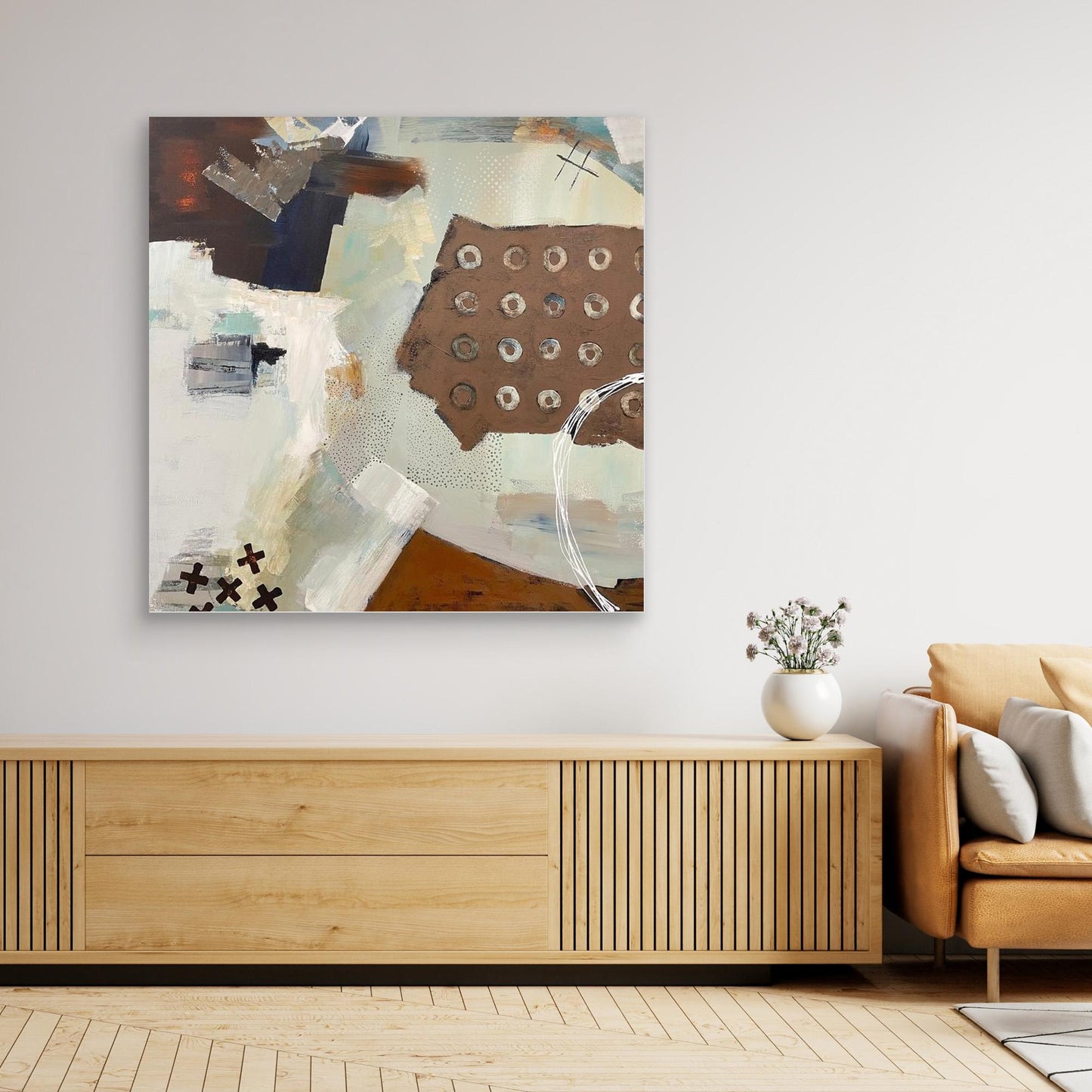 Abstract canvas print 'Echoes' on a wall above a wooden console table in a living room.
