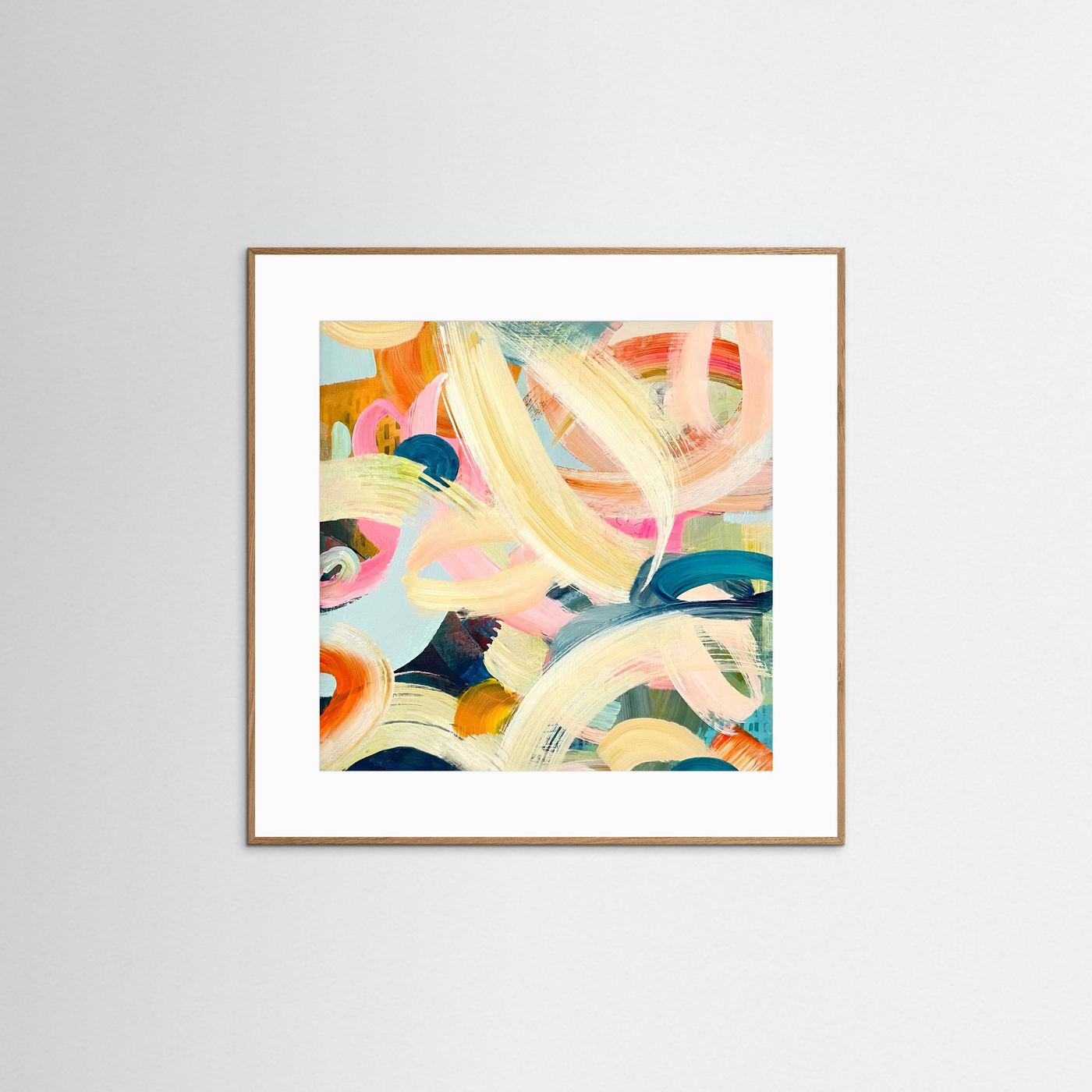 Framed Freewheeling colourful abstract print on a white wall