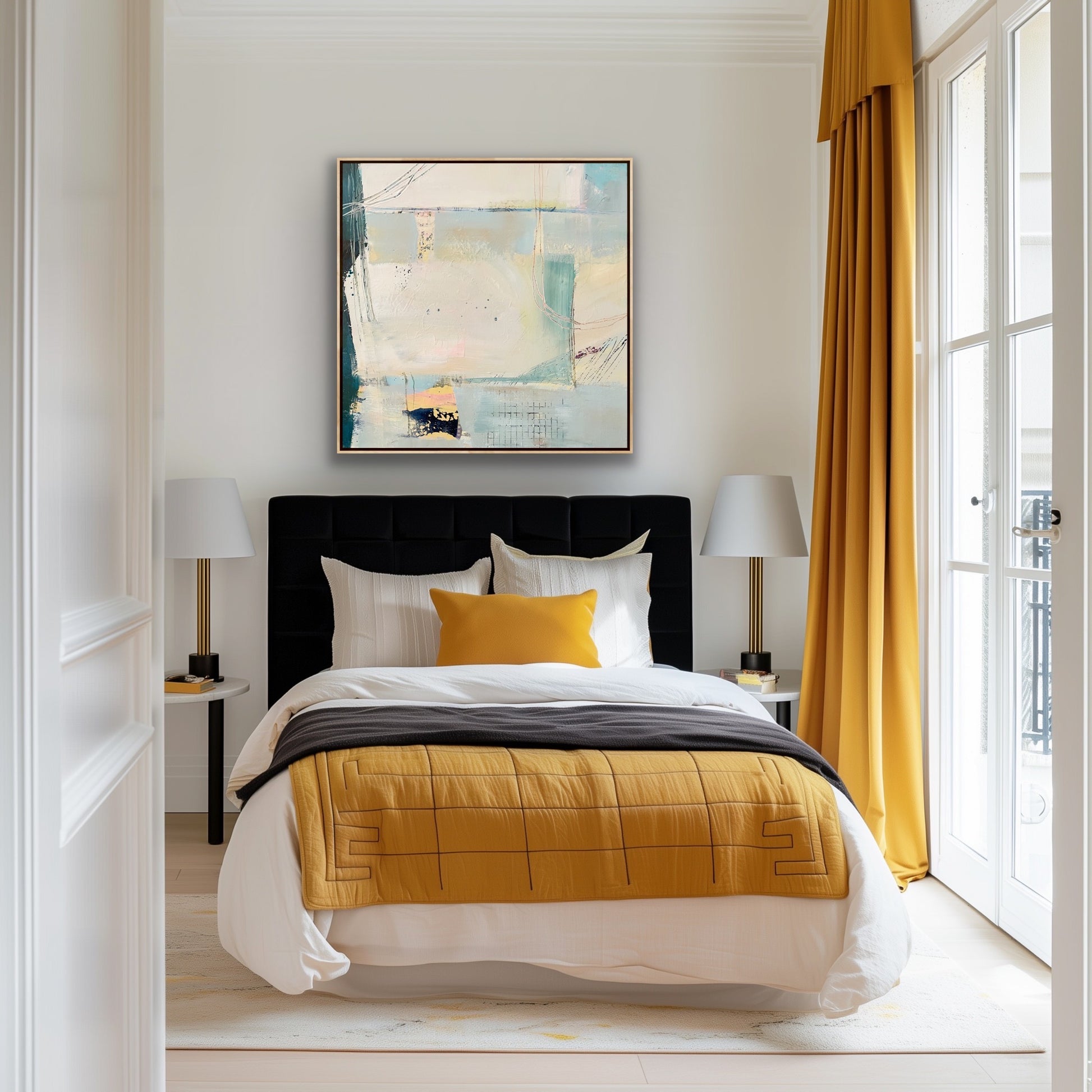 Abstract coastal themed, framed canvas print on a white wall in a room above a black bed with yellow and white linen, and yellow curtains
