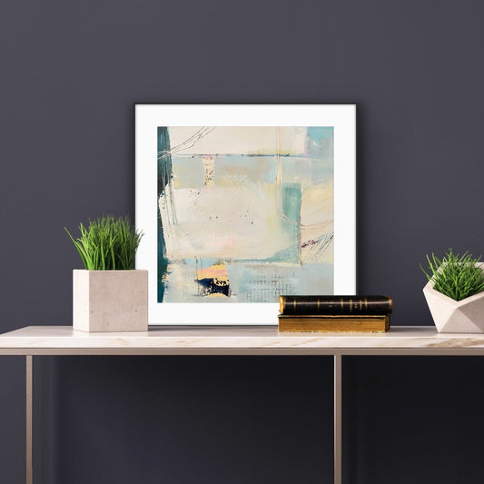 Modern interior with a console table against a dark wall, featuring a framed abstract Art Print on Paper 'Harbour' and decorative items.