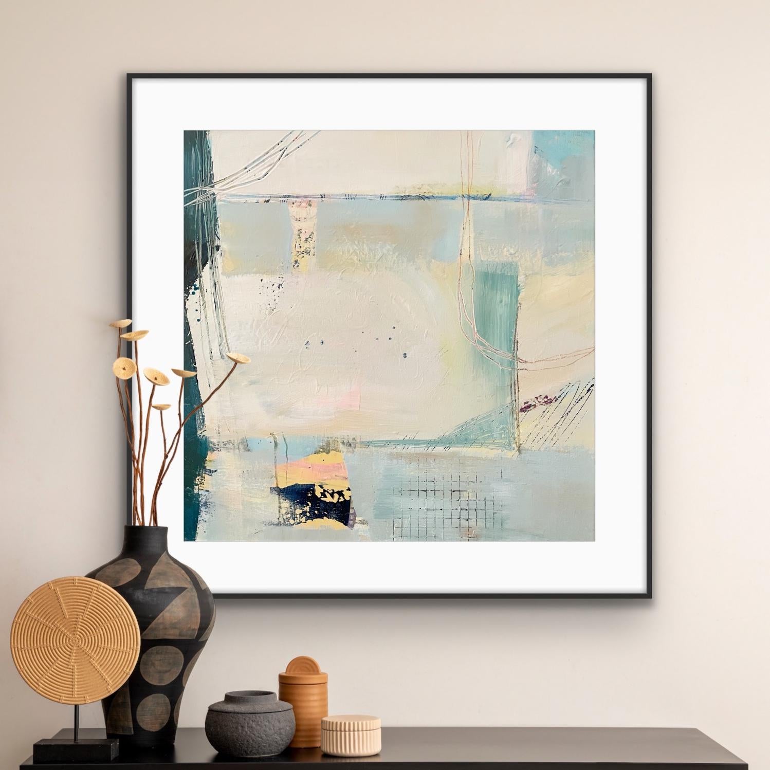 Framed abstract art print on paper, 'Harbour' on a wall with decorative items below.