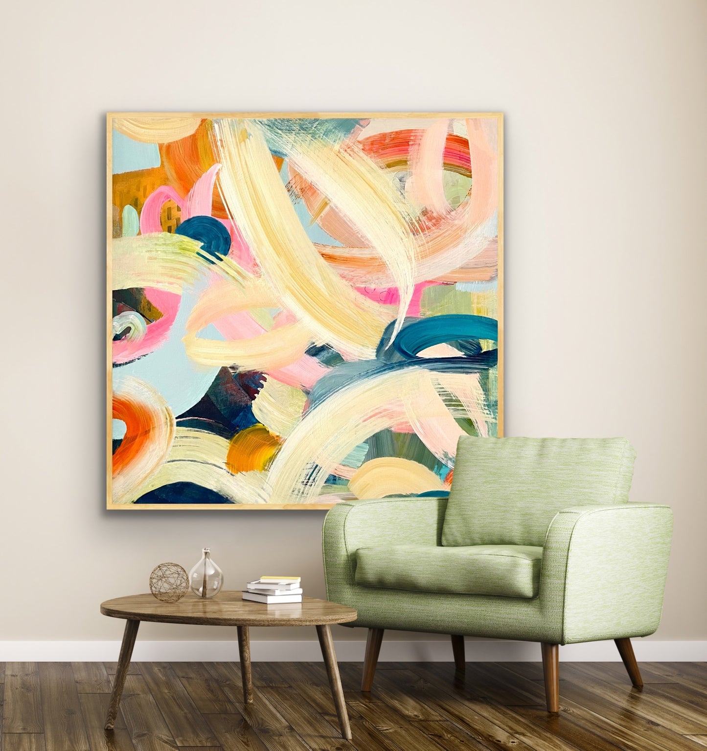 Colorful abstract Alison Gilbert canvas print 'Freewheeling'on a wall above a green armchair in a living room.