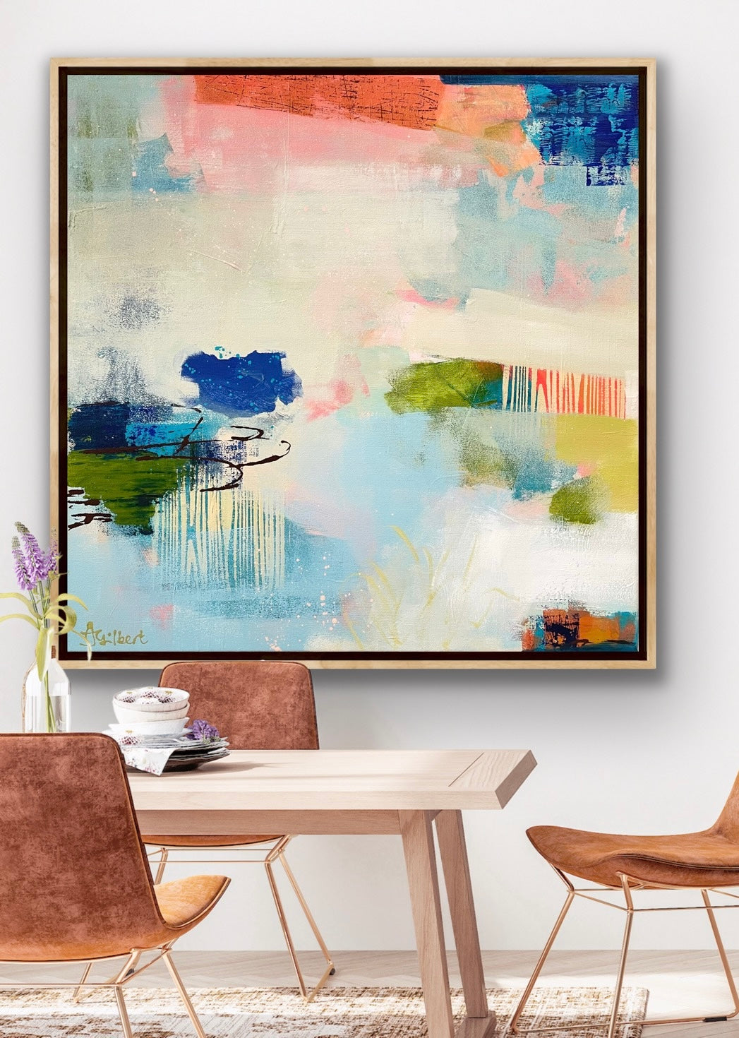Abstract canvas print by Alison Gilbert Art in a modern dining room with chairs and a table.