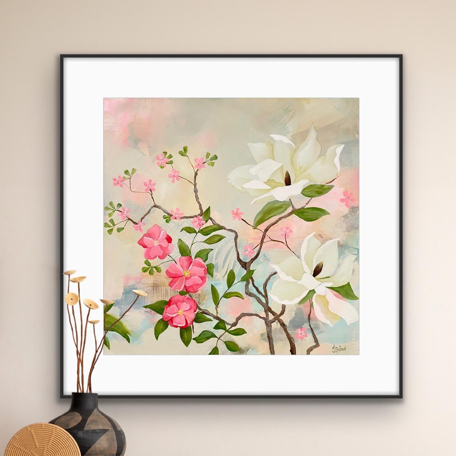 Framed floral artwork 'Maytime Magnolias' with pink and white flowers on a beige wall.