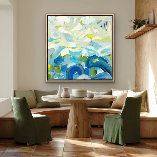 Modern living room with abstract Alison Gilbert canvas print 'Outward Expression' on the wall, a wooden table, and green chairs.