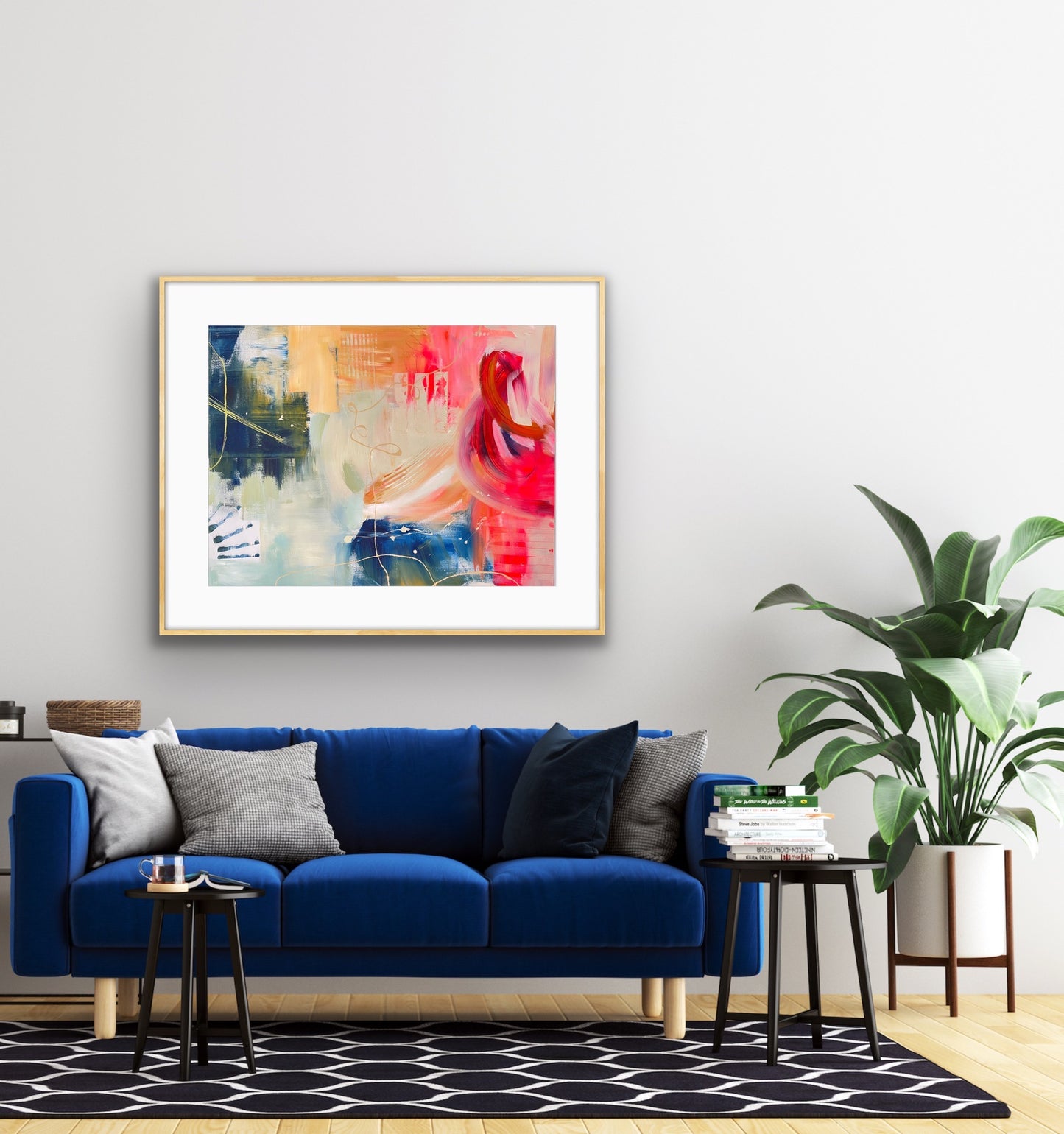Modern living room with a blue sofa, abstract art on the wall, and decorative elements.