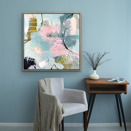 Abstract Alison Gilbert canvas print 'Shallow Pool' on a wall above a chair and side table.
