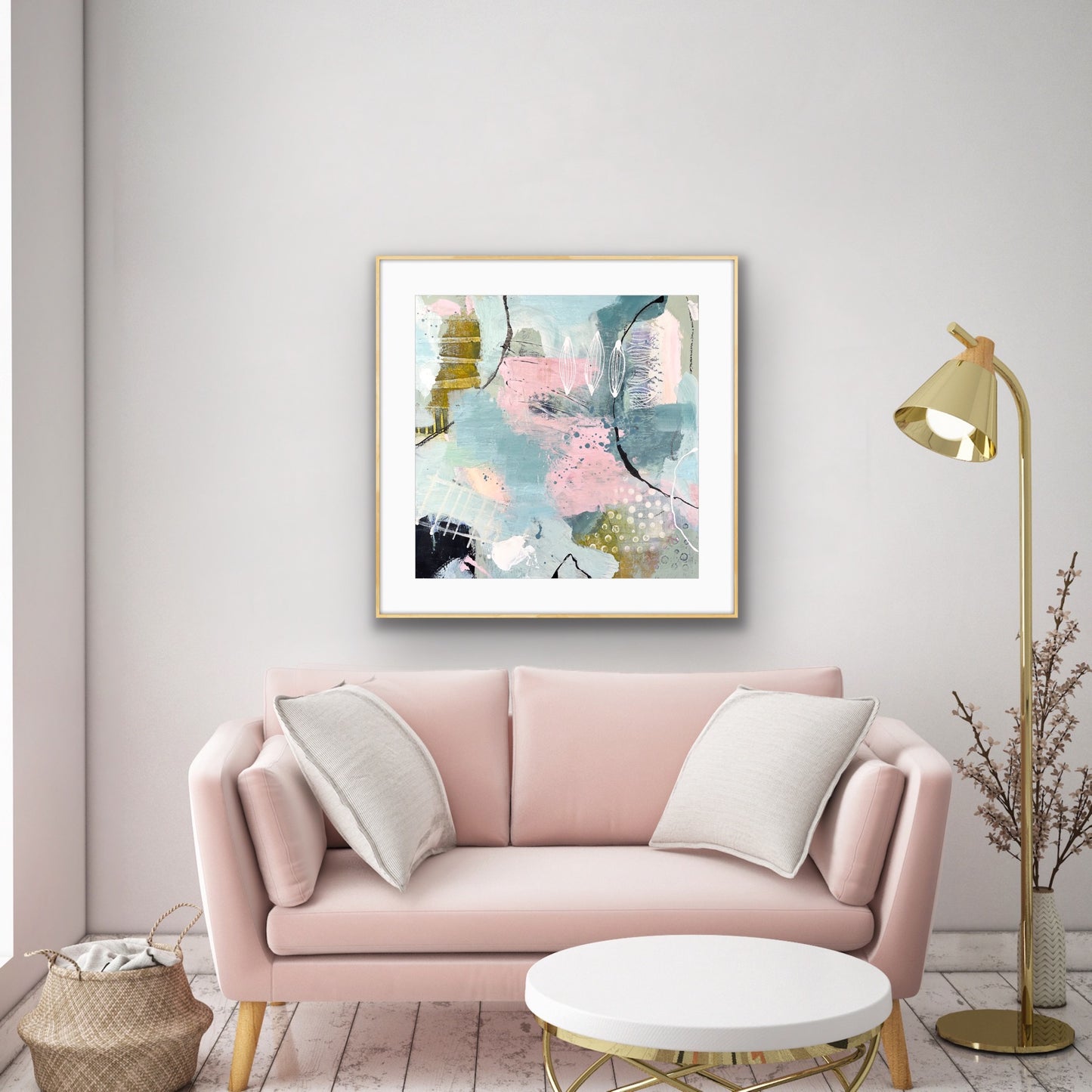 Framed giclee art print "Shallow Pool" by Alison Gilbert Art, on a light grey wall above a pale pink sofa. in a room with a gold standard lamp.