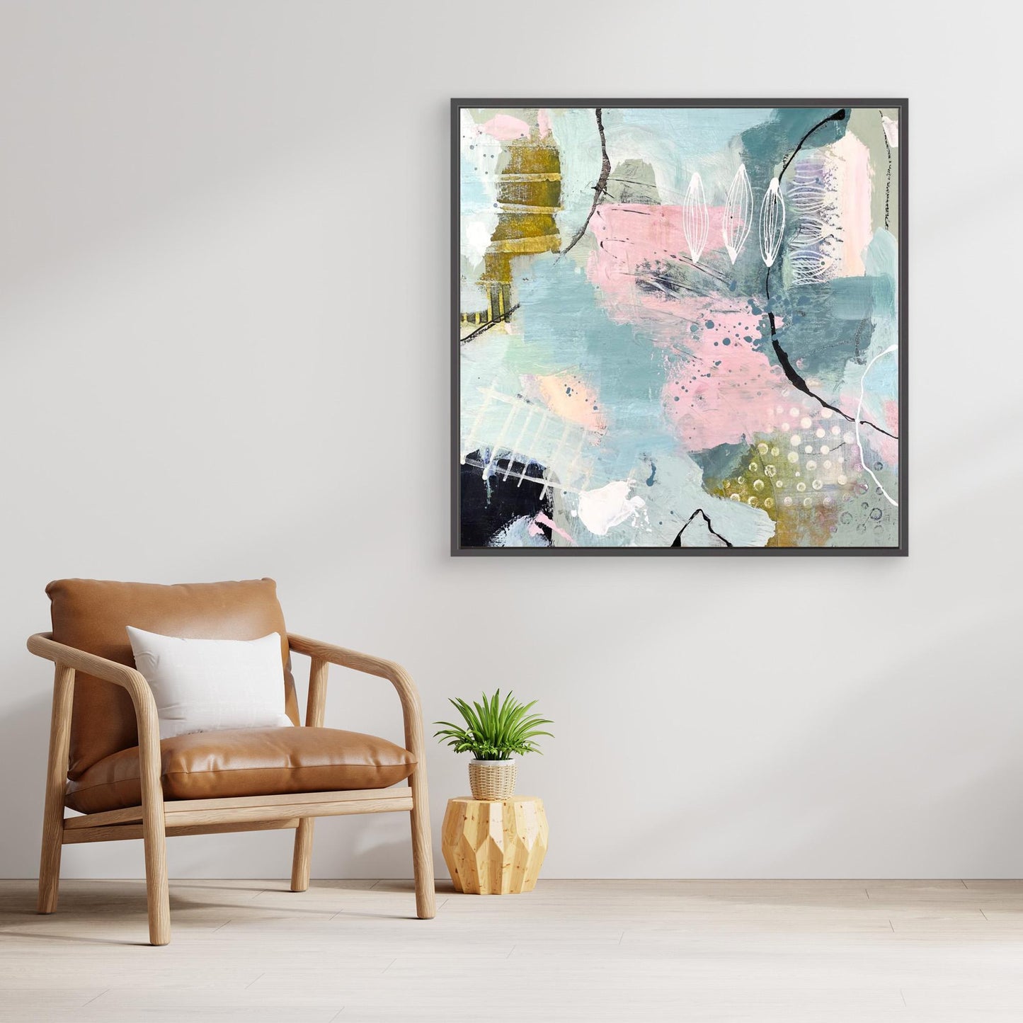 Abstract canvas print 'Shallow Pool'on a wall above an armchair in a living room.