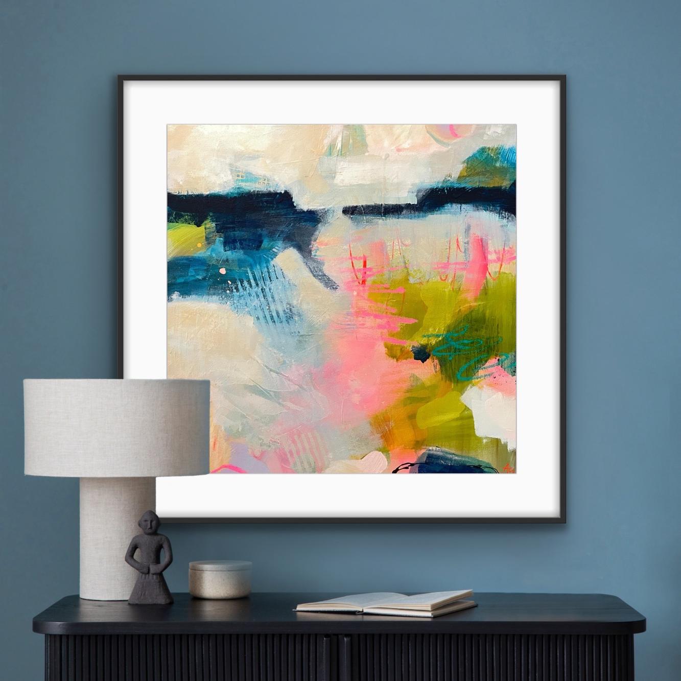 Framed art print 'Shepherd's delight' on a blue wall above a black console table with decorative items.