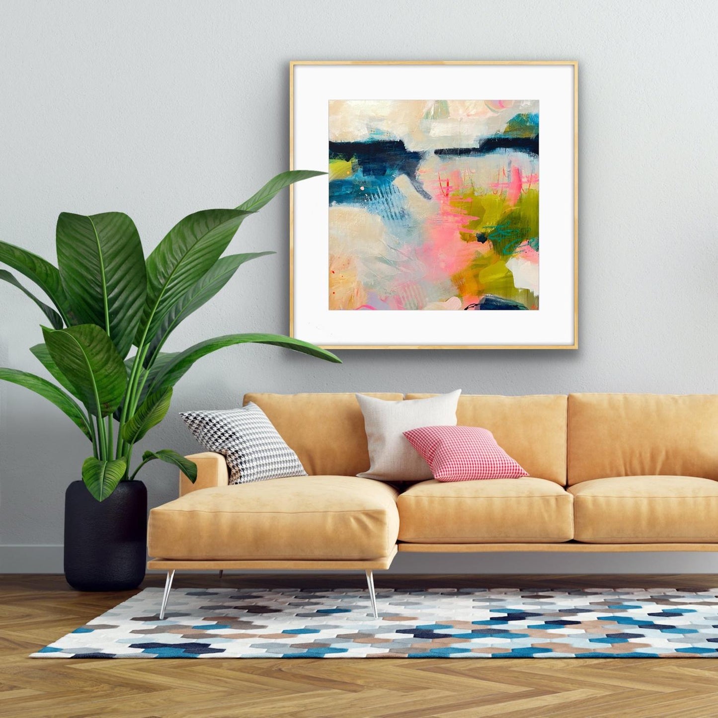 Living room with a yellow sofa, colourful Framed Art Print 'Shepherd's Delight,' and a large pot plant.