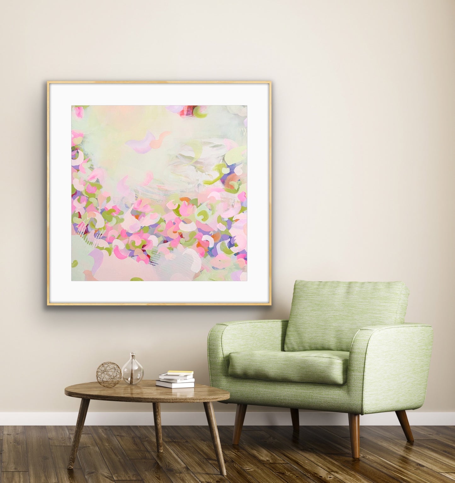 Framed pastel coloured abstract print "Spring Serenade" on a wall above a green armchair in a living room.