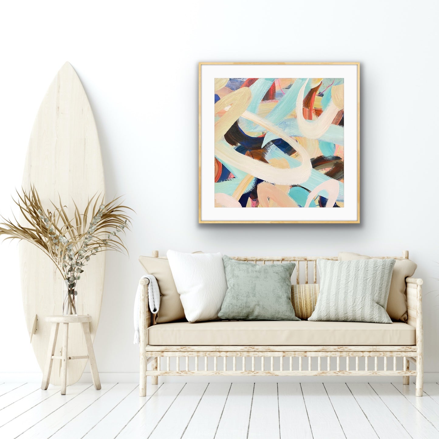 Modern living room with a sofa, decorative pillows, and abstract art print 'Twist & Shout' on the wall.