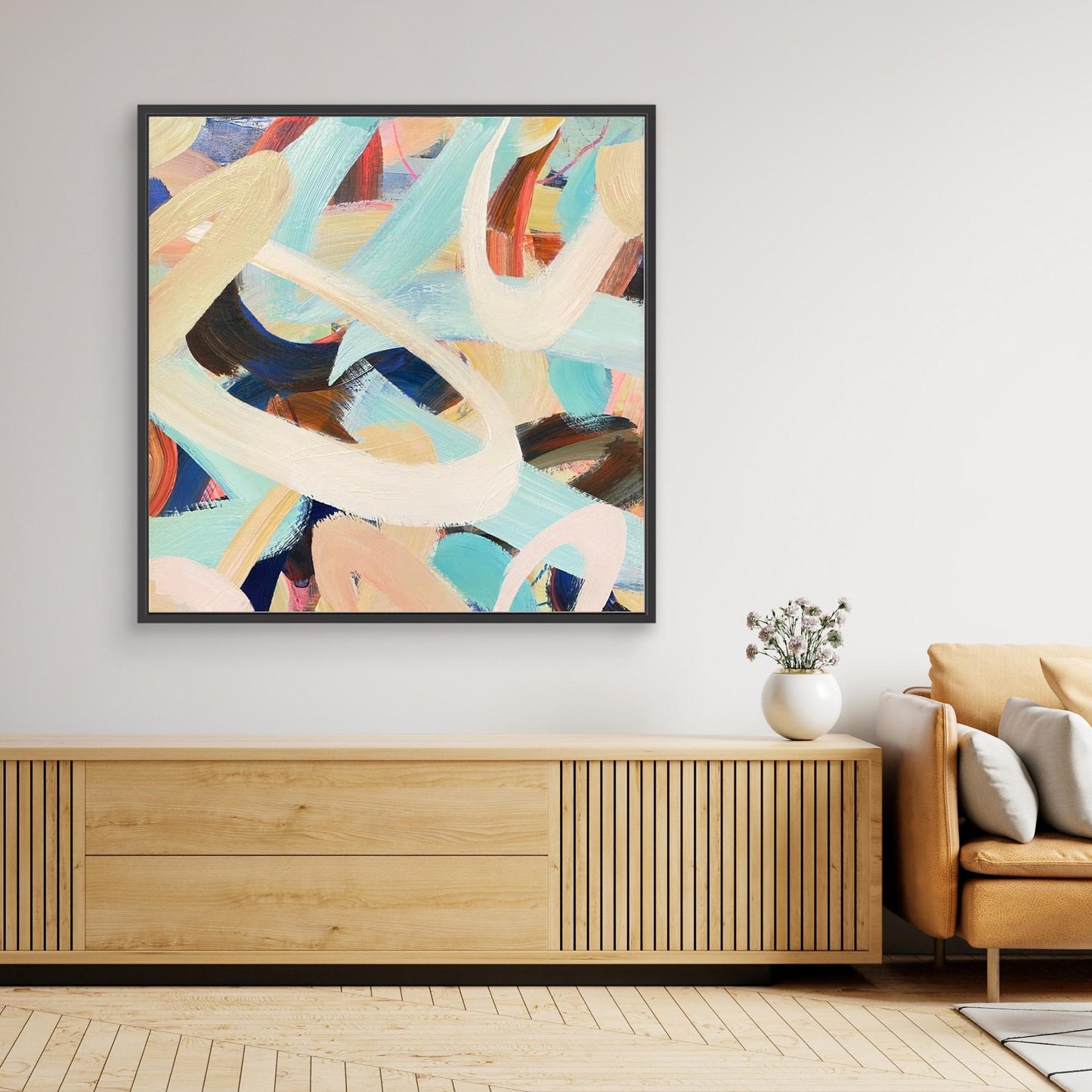 Abstract Alison Gilbert canvas print 'Twist and Shout' on a wall above a wooden cabinet in a living room.