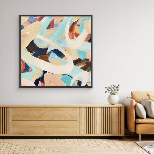 Abstract Alison Gilbert canvas print 'Twist and Shout' on a wall above a wooden cabinet in a living room.