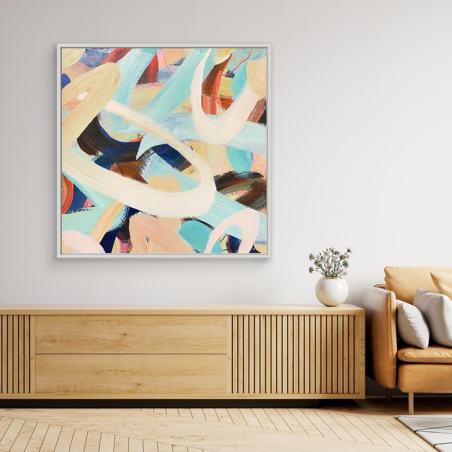 Abstract Alison Gilbert canvas print 'Twist and Shout' on a wall above a wooden console table in a living room.
