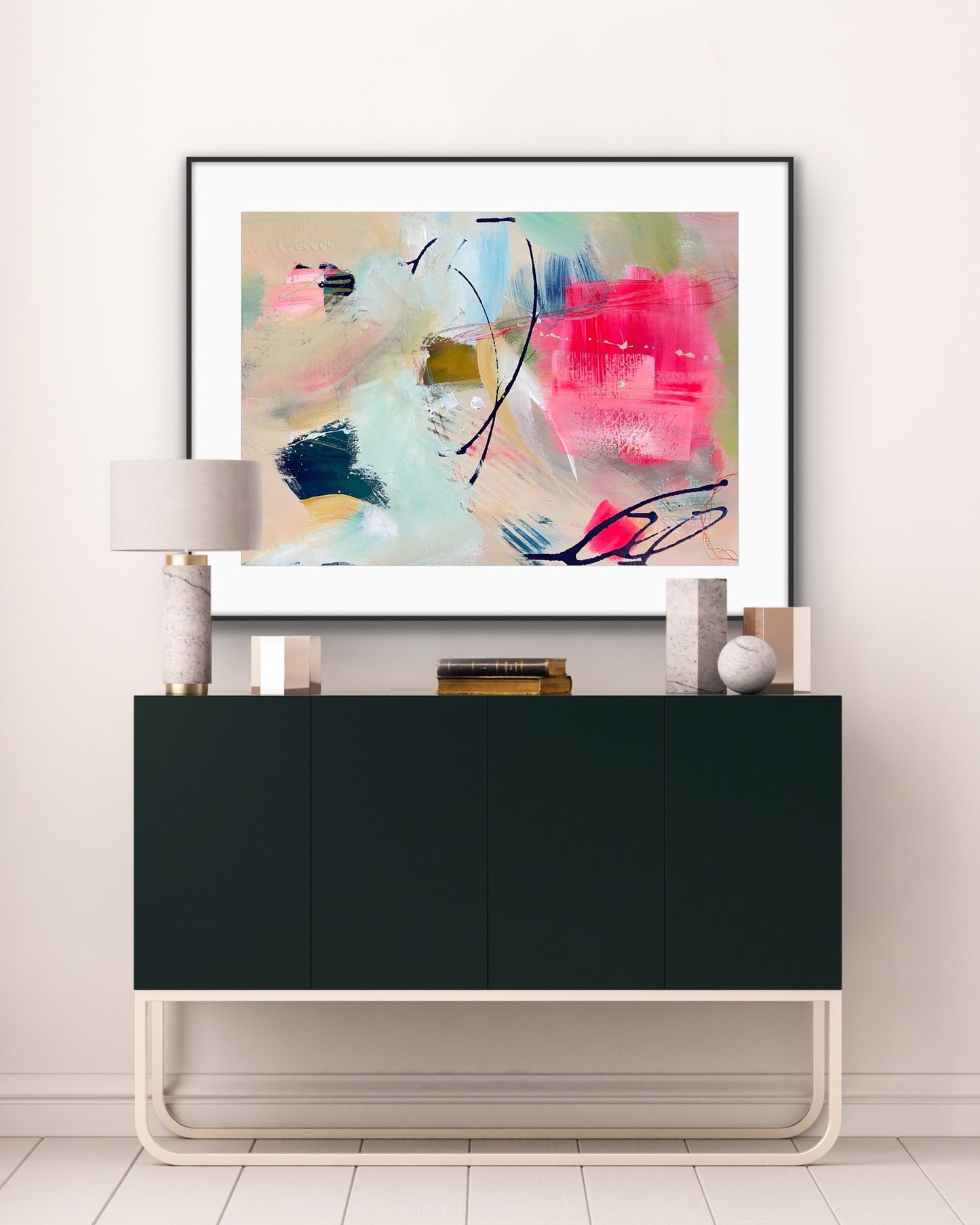 'Unexpected Arrival' Framed Print on Paper on a wall above a black cabinet in a room.