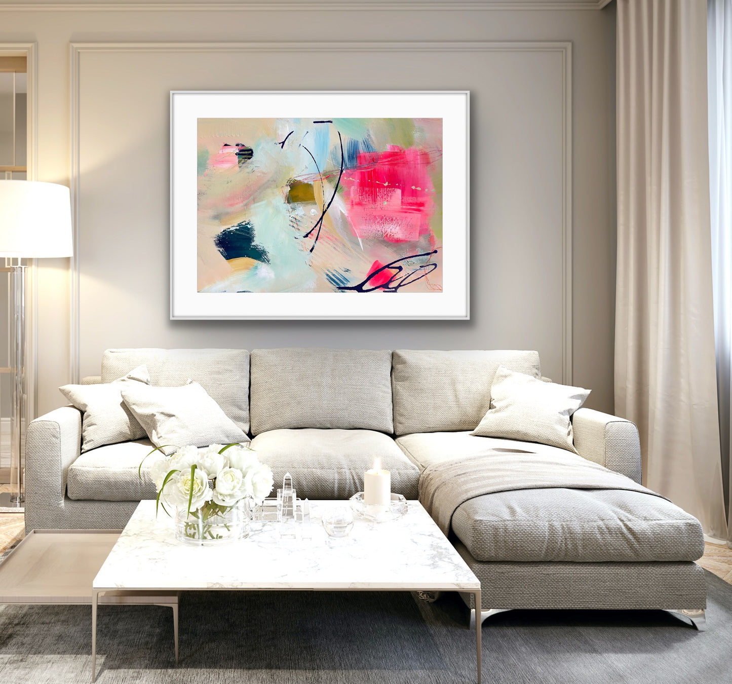 Modern living room with a gray sectional sofa, coffee table, and abstract Framed Art Print on Paper, 'Unexpected Arrival' on the wall.