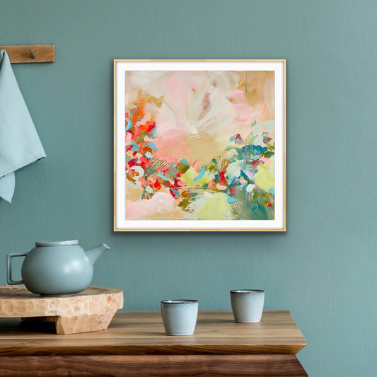 Framed abstract art print "Whispers of a New Day" from Alison Gilbert Art, on a teal wall with a wooden table and teapot.