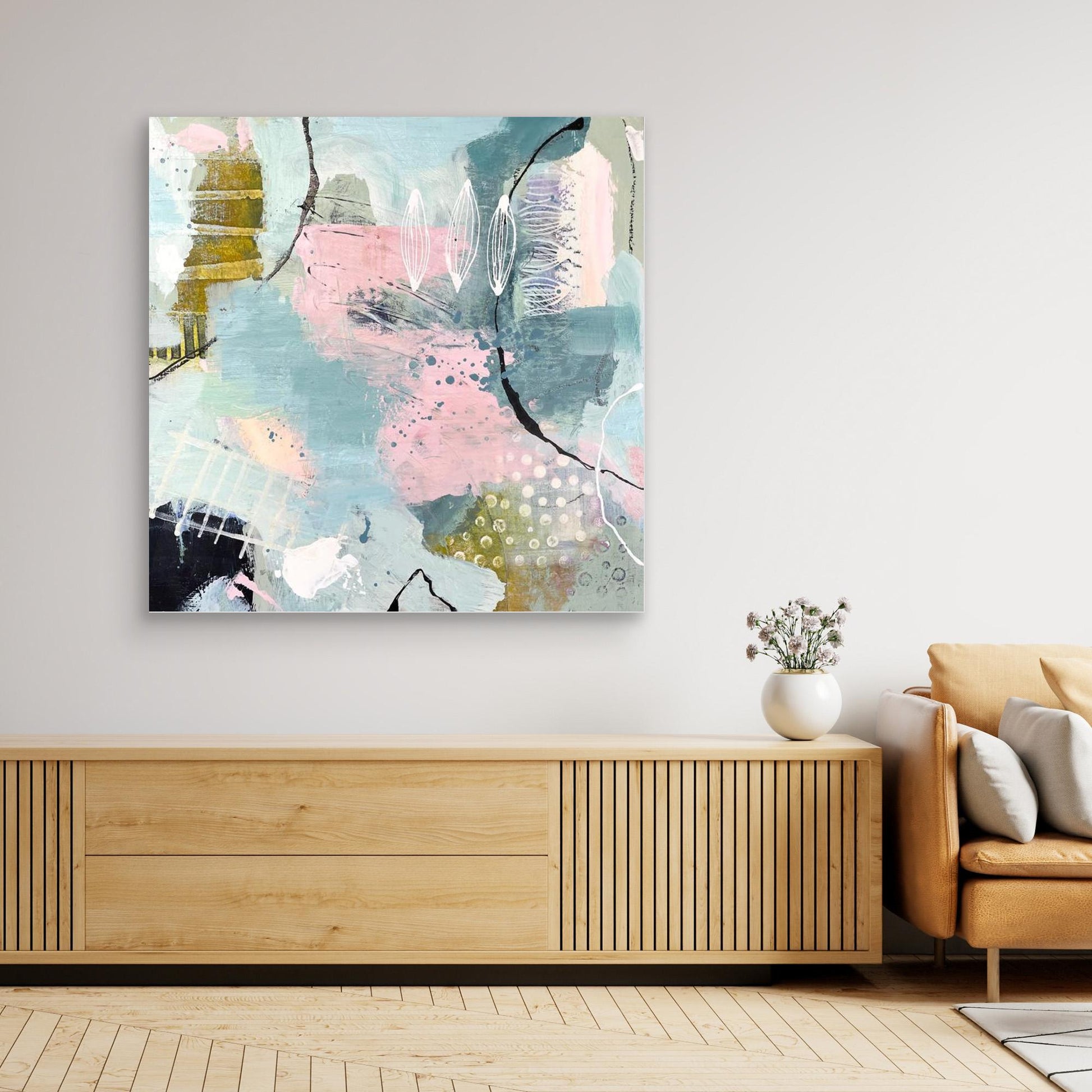 Abstract canvas print 'Shallow Pool'on a wall above a wooden console table in a living room.